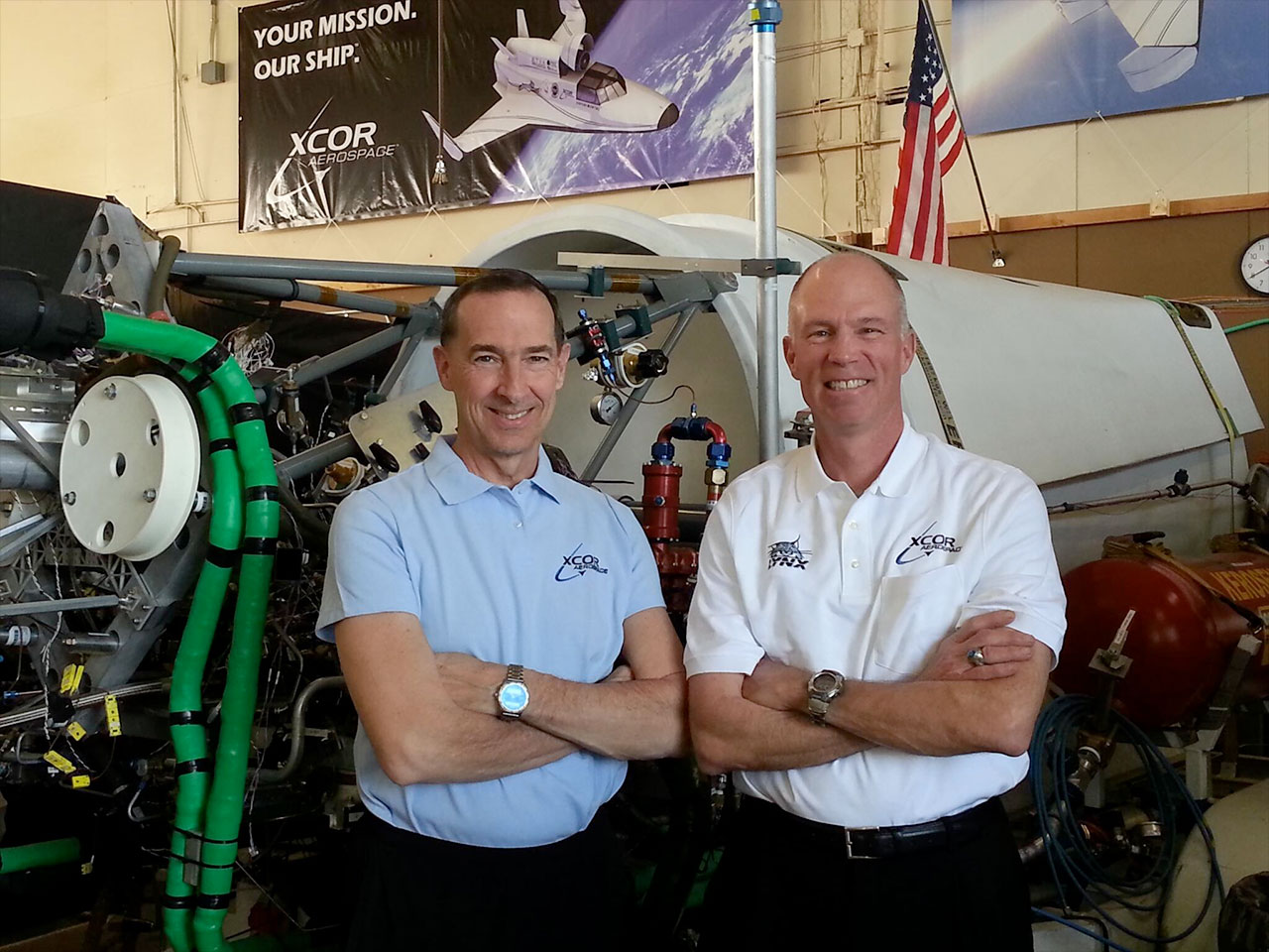 Rick Searfoss, XCOR chief test pilot (at right), with SpaceShipOne and XCOR test pilot Brian Binnie in XCOR&#039;s hangar in 2014. 