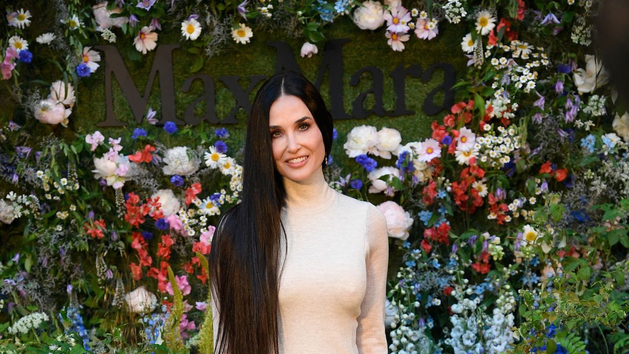 Demi Moore&#039;s cool beige maxi dress was the perfect showstopping look as the star stepped out for the Max Mara fashion show in Stockholm