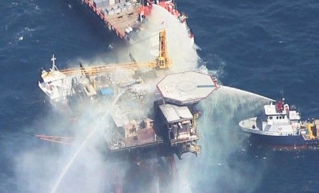 Boats spray water on an oil platform after it exploded in the Gulf of Mexico on September 2, 2010 off the coast of Louisiana. 