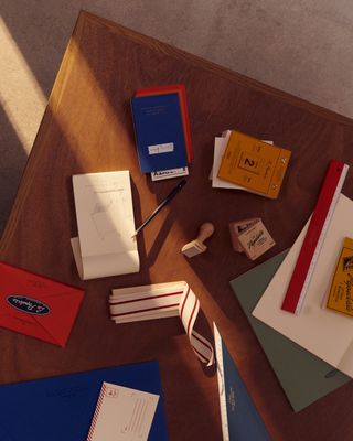 Assorted Zara Home and Saint-Lazare stationery items on desk