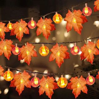 Orange string lights with maple leaves