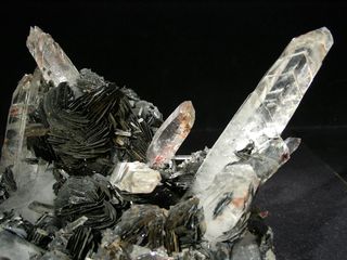 Quartz crystals growing out of hematite.