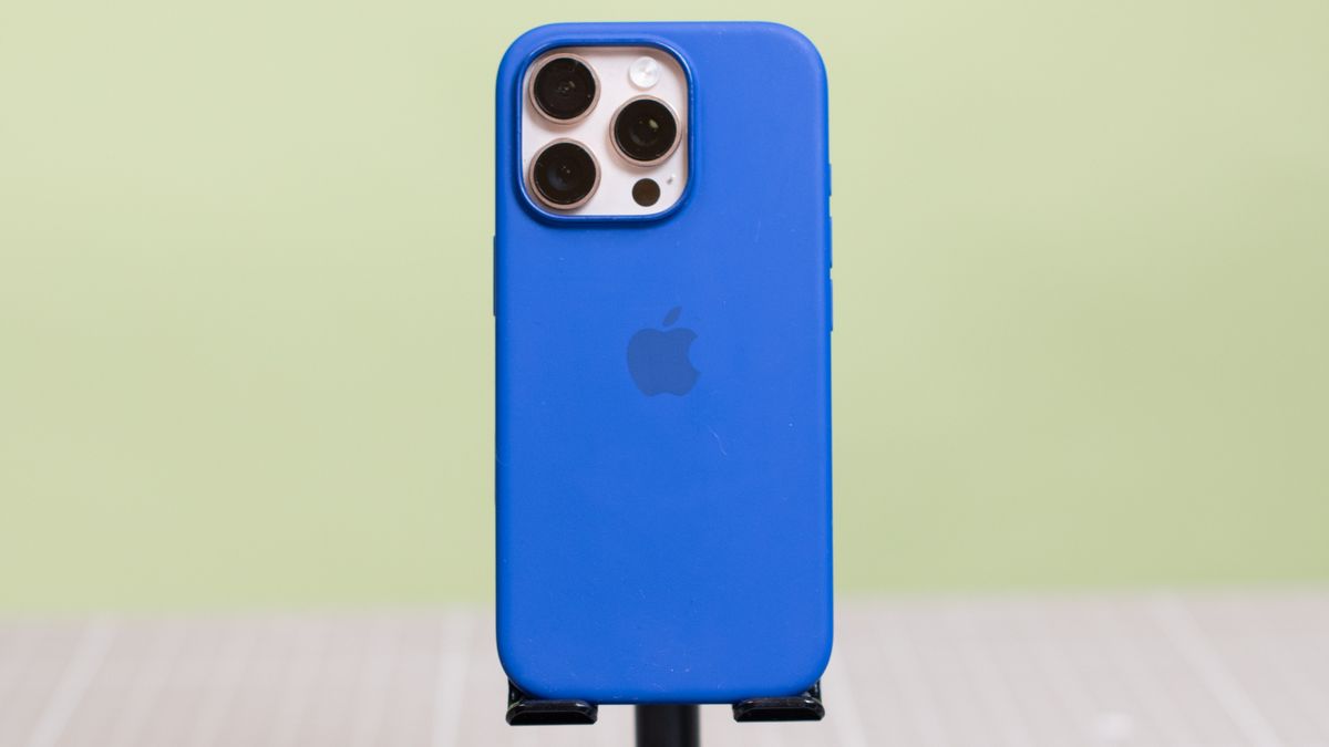 Apple iPhone 16 Pro Silicone Case from back showing Apple logo with desert titanium Apple iPhone 16 Pro inside