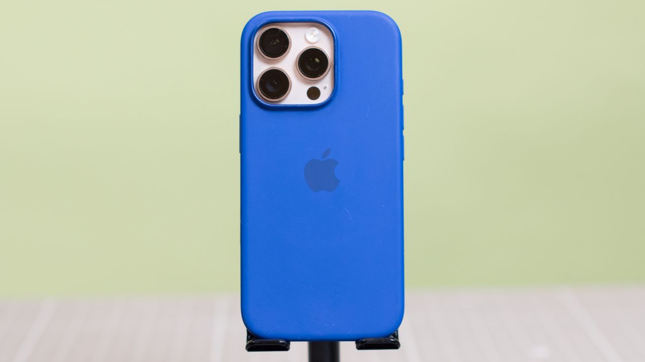 Apple iPhone 16 Pro Silicone Case from back showing Apple logo with desert titanium Apple iPhone 16 Pro inside
