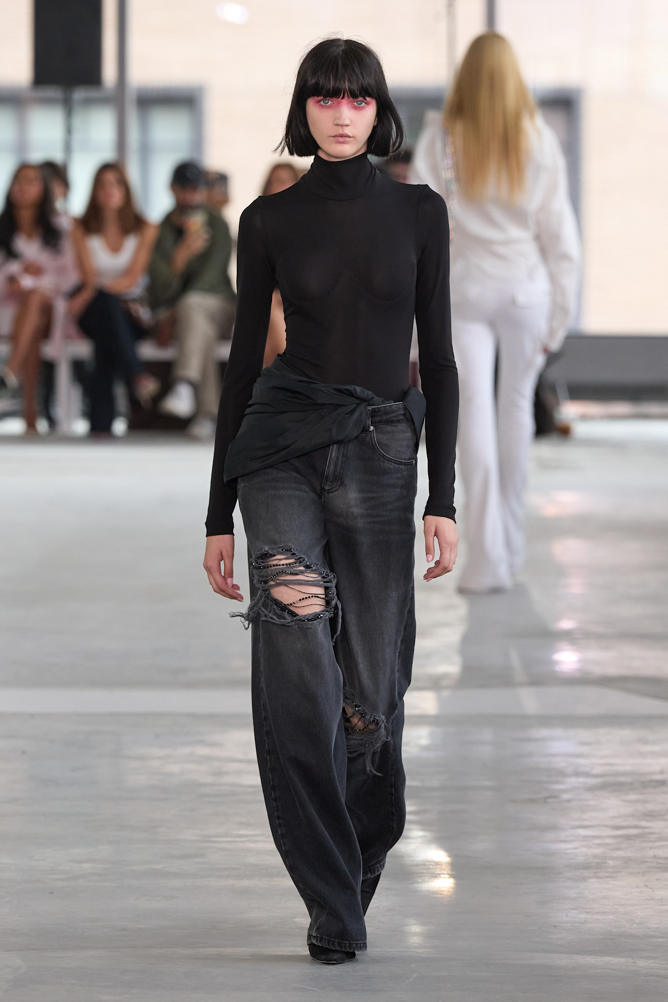 A model wore ripped jeans on the Area spring 2026 runway