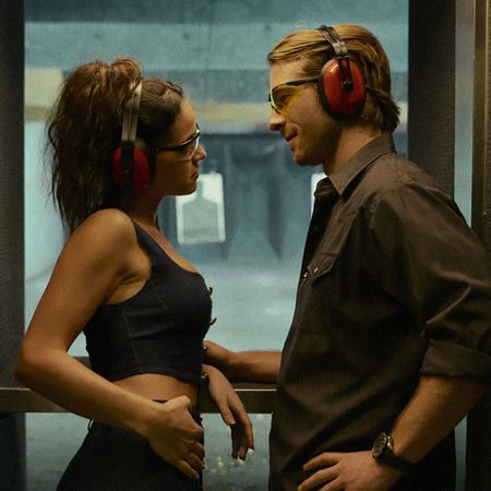 adria arjona and glen powell in hit man in a shooting range