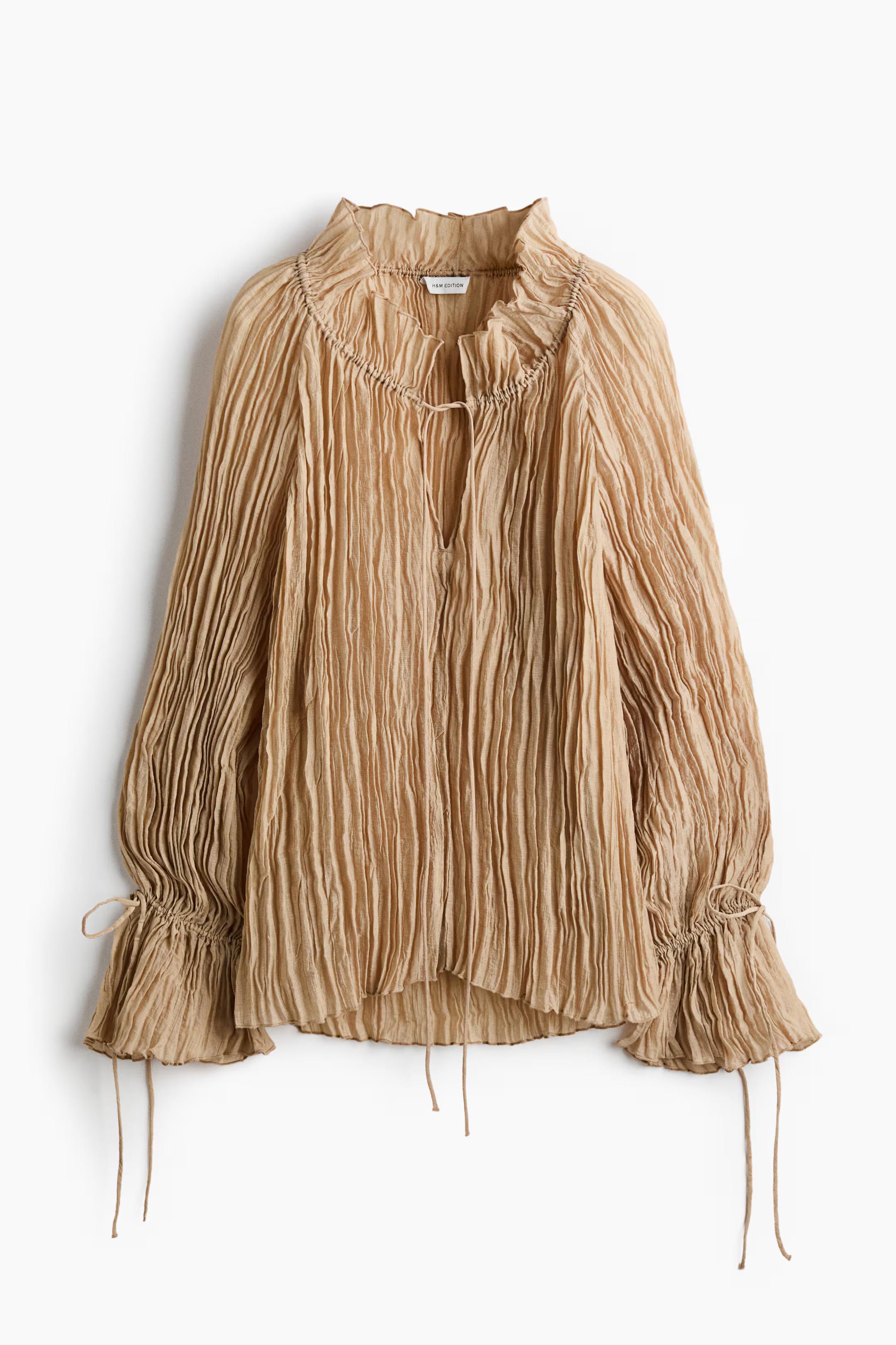 A beige, pleated bohemian blouse from H&amp;amp;M