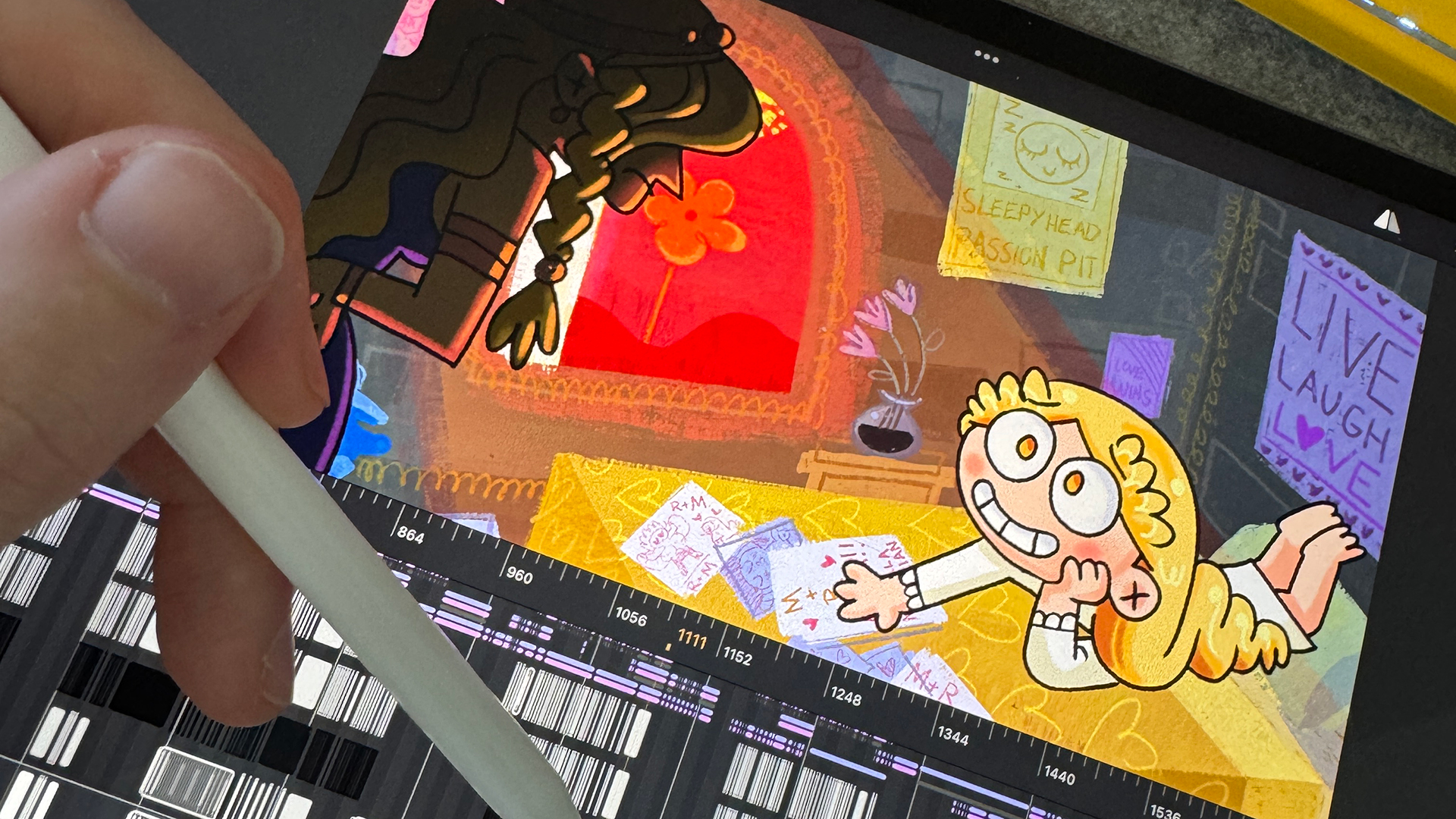 Photo of a person animating an Elden Ring cartoon scene on an iPad