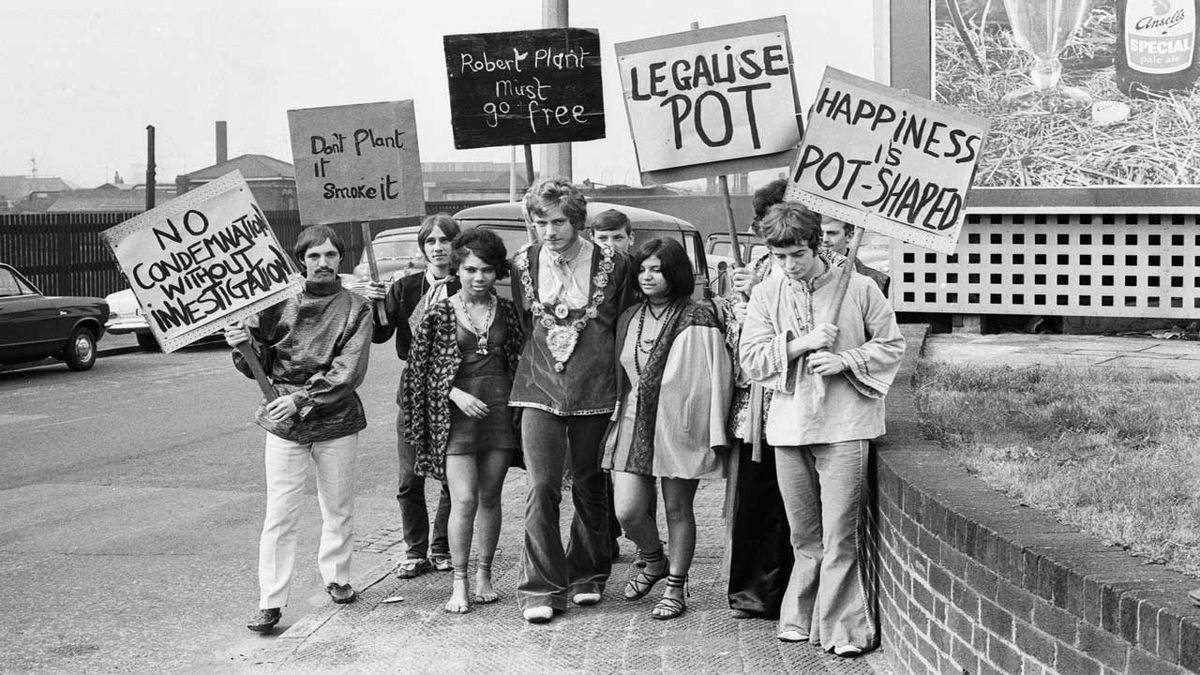 Robert Plant with some of his followers holding Legalise Pot banners