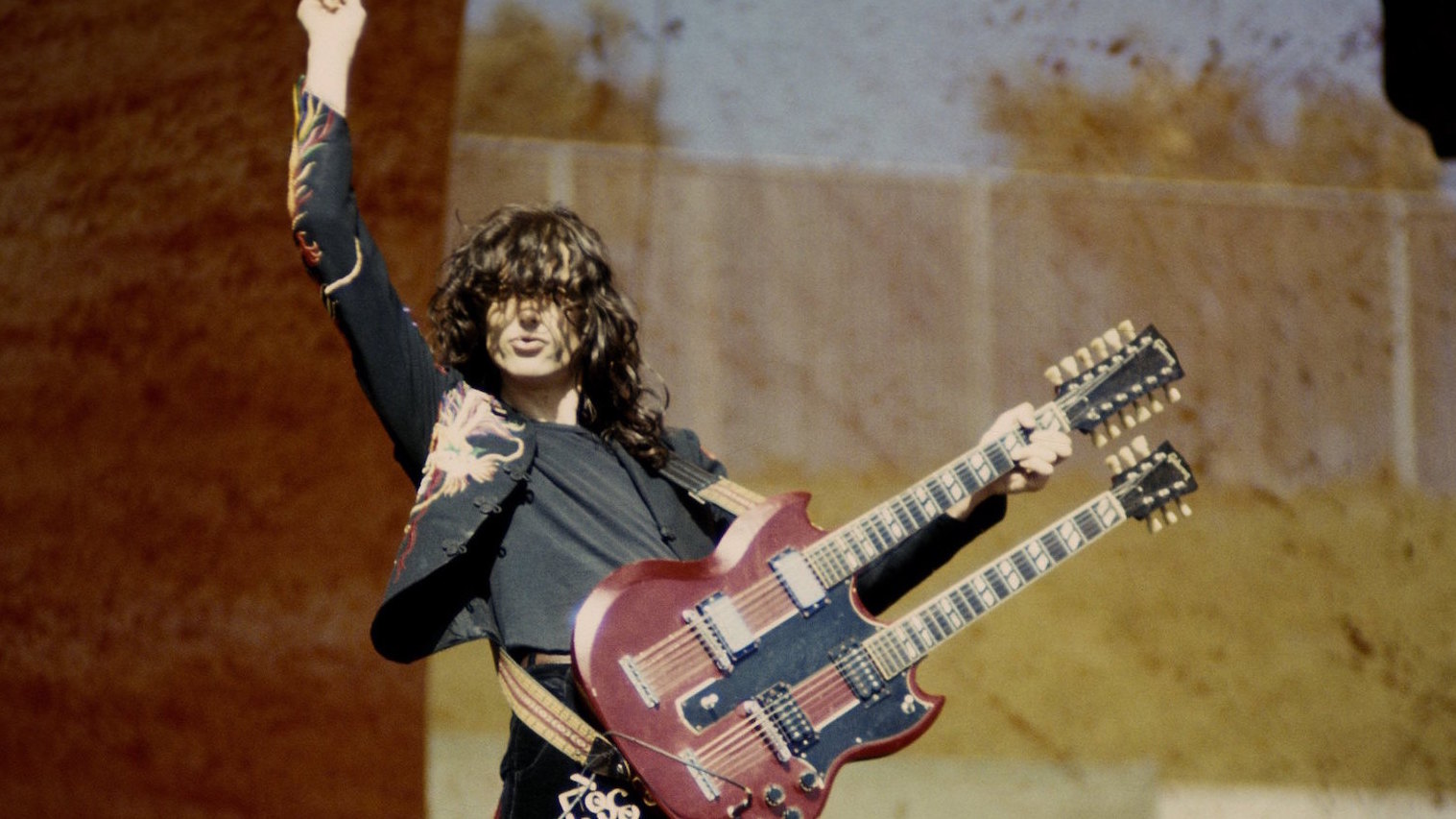 Jimmy Page performing with Led Zeppelin at the Oakland Coliseum in Oakland, California on July 23, 1977