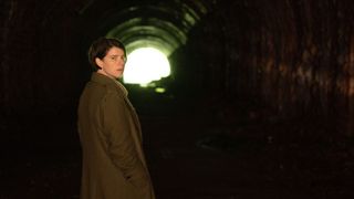 Jessie Buckley in a tunnel in Men