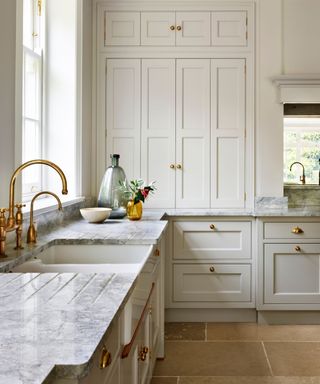 White bespoke fitted kitchen with shaker style doors by Martin Moore