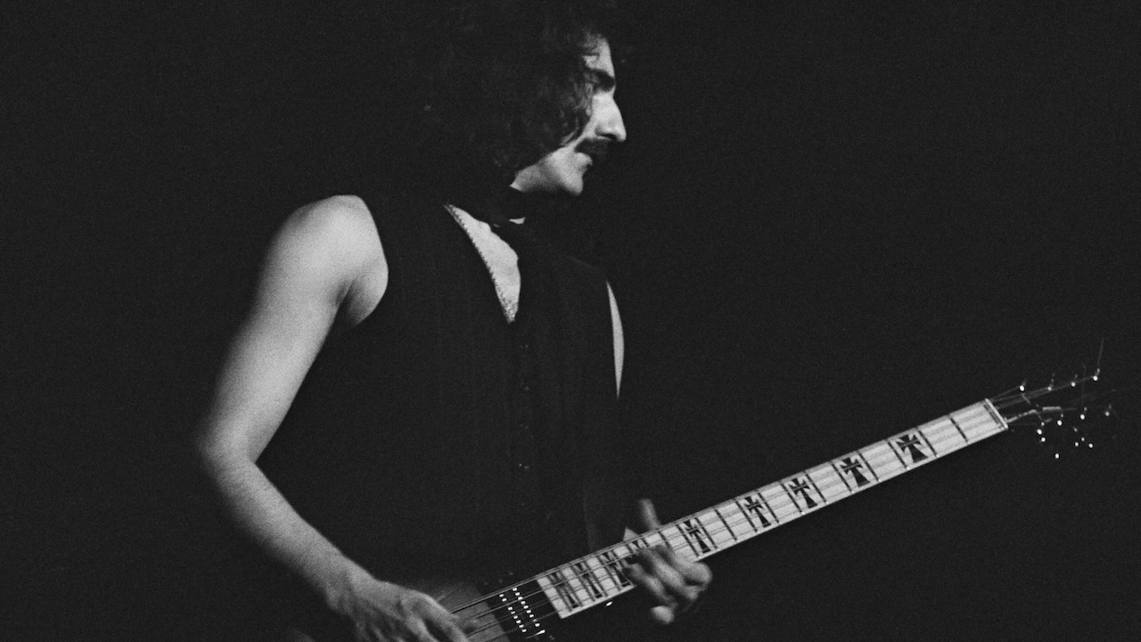 Bassist Geezer Butler of Black Sabbath performs on stage at Hammersmith Odeon, London, January 1976.