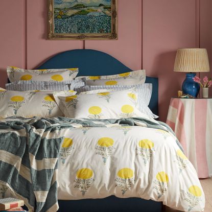 Molly Mahon Marigold woodblock floral bedding from Secret Linen Store in a pink bedroom