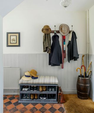 hallway with shoe rack with cushion and photo frame