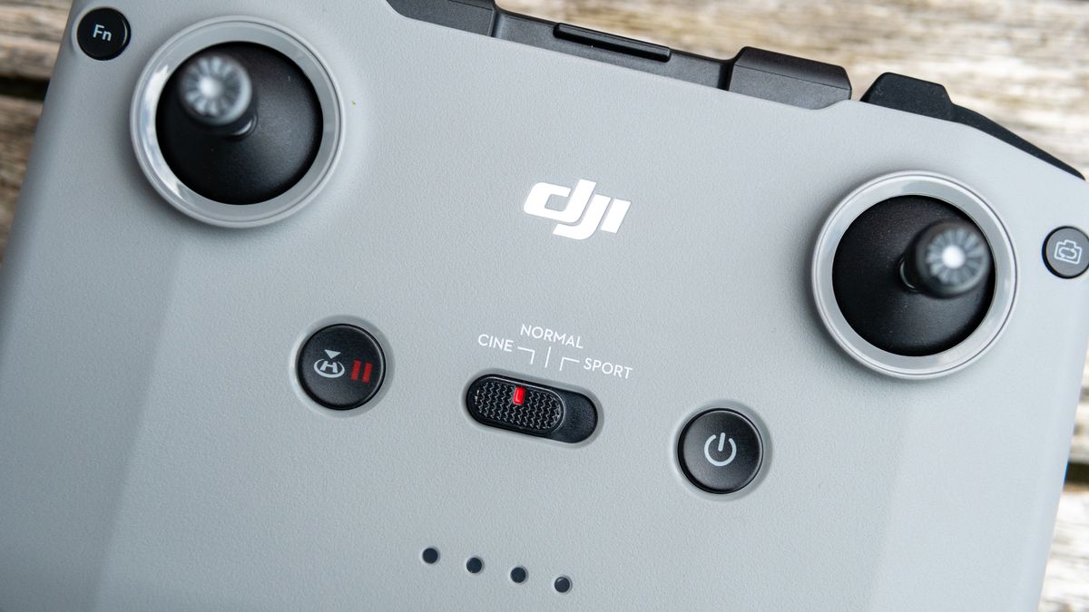 A controller for the DJI Air 2S drone on a wooden table