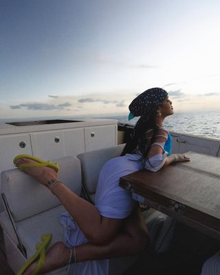 Rihanna in Fenty x Puma flip flops in Barbados.