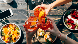 Friends drinking aperol spritz