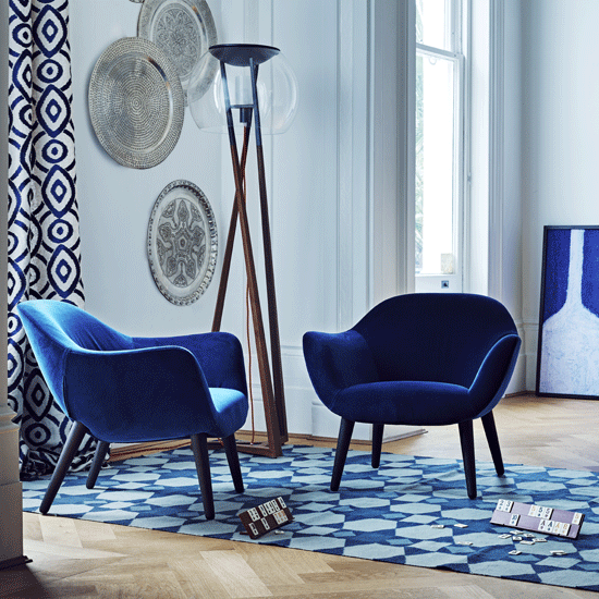 living room with blue armed chairs