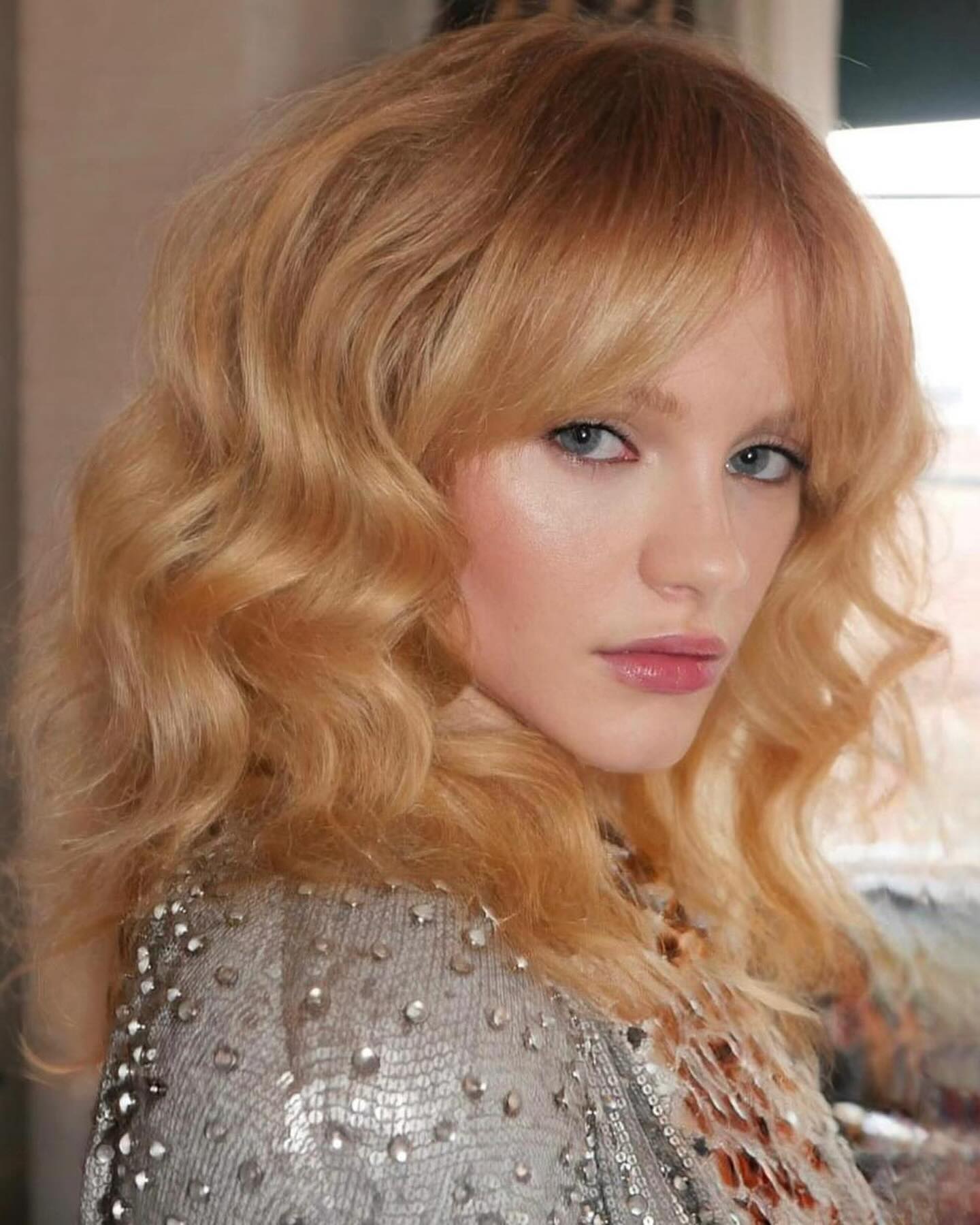 emma laird with brushed-out curls