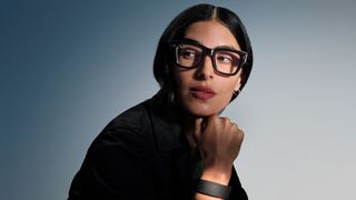 An official lifestyle shot of someone wearing Meta Ray-Ban Display Glasses