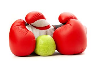 Apple in boxing gloves