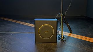 Yaber K3 Pro subwoofer on a floor in a showroom