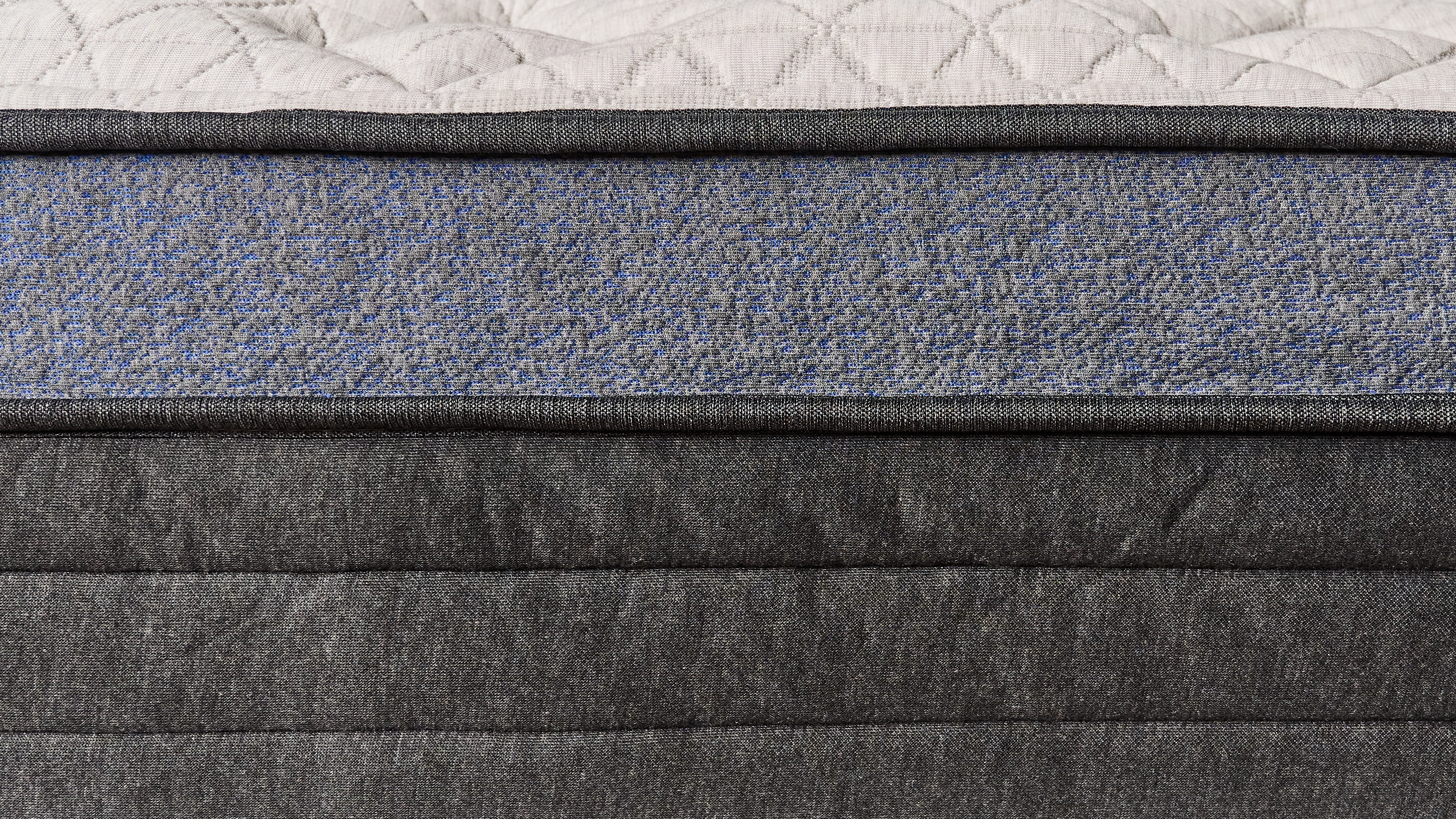 The image shows a close up of the foot of the Helix Midnight Luxe mattress