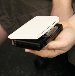 Since it looked like an Oreo missing a top layer, we decided to spray paint the solar panels to match the DS' black case.
