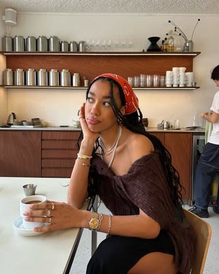 Amaka Hamelijnck wearing an orange bandana