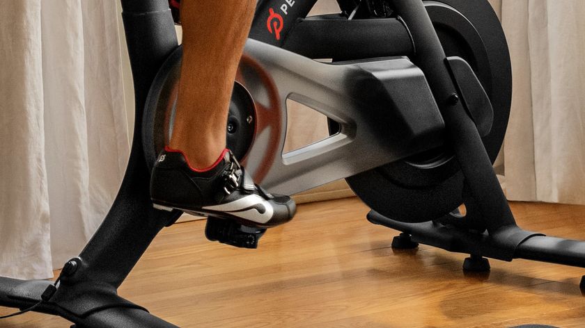 Man wearing Peloton shoes while working out on a Peloton Bike