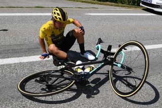 Primoz Roglic gets up after his crash while leading GC in Critérium du Dauphiné