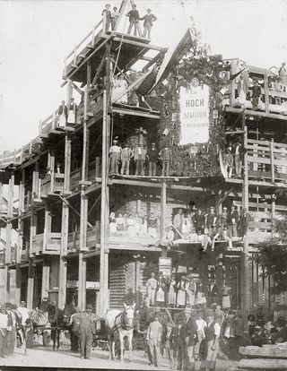 Construction workers celebrating topping-out ceremony of the building located Hegerleinstrasse/Arnethgasse. Vienna, 16th district. Photograph around 1900. (©Imagno/Getty Images)