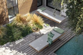Go Modern Furniture sun loungers by pool