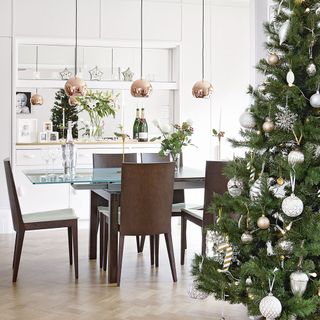 dining room with christmas tree