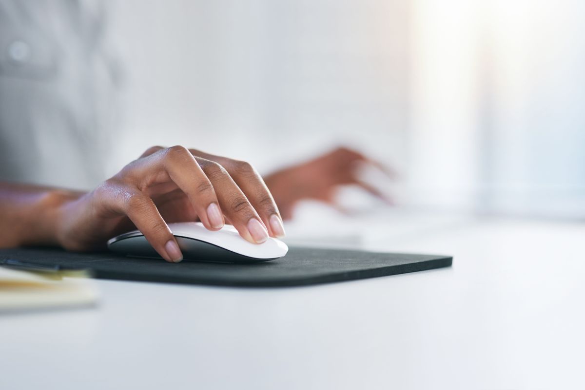 Hand using computer mouse