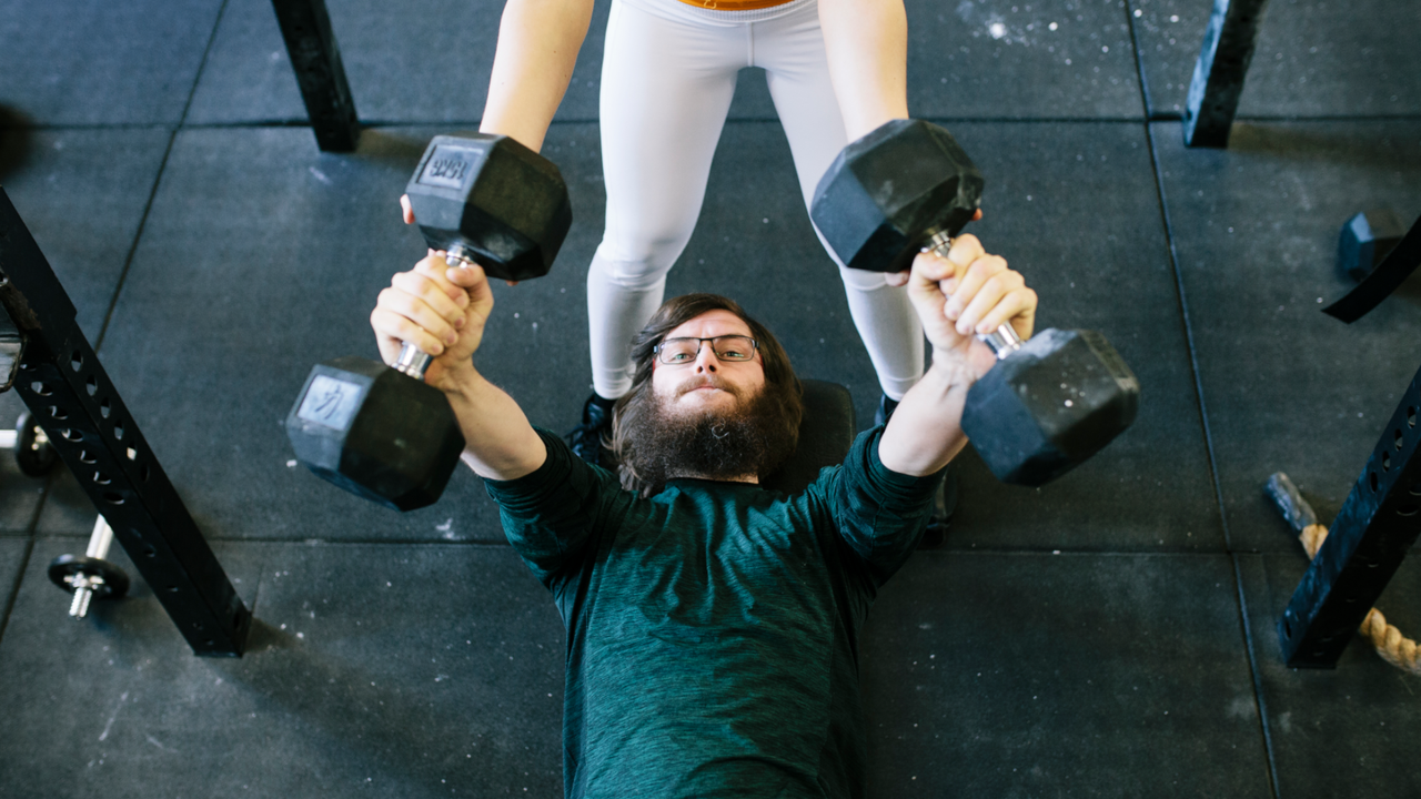 Man doing dumbbell chest press