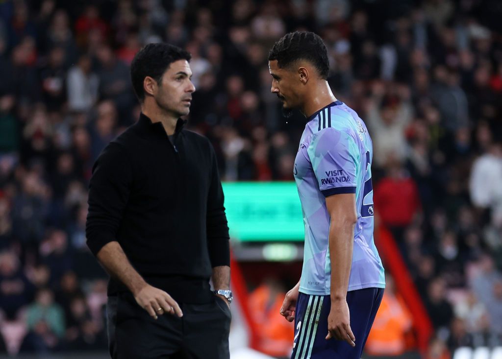 William Saliba of Arsenal past Mikel Arteta manager / head coach of Arsenal as he walks off after being shown a red card during the Premier League match between AFC Bournemouth and Arsenal FC at Vitality Stadium on October 19, 2024 in Bournemouth, England.