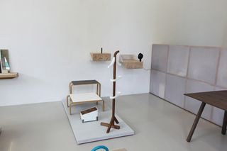 The plinth with low table and white wall