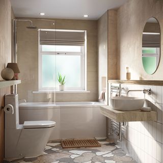 Neutral bathroom with bath underneath window