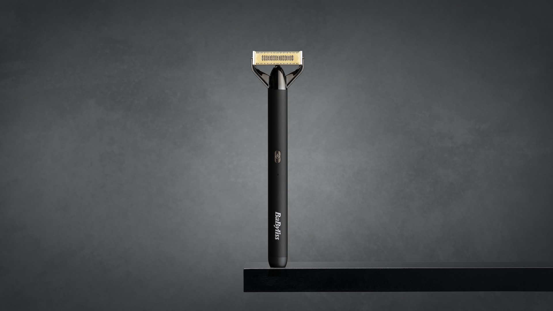 Super-X Metal Series X-Blade in black and gold sitting on a shelf