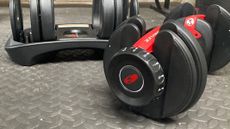 Bowflex SelectTech 552 adjustable dumbbells being tested by our reviewer 