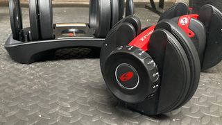 Bowflex SelectTech 552 adjustable dumbbells being tested by our reviewer