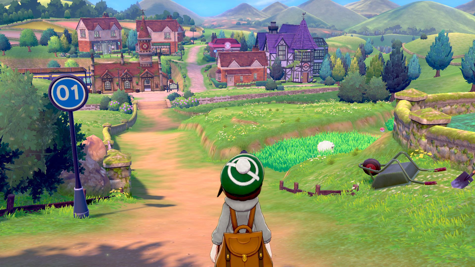 A girl looks towards a town in Pokemon Sword and Shield for Nintendo Switch