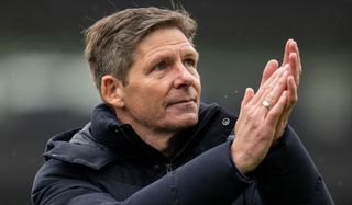 Crystal Palace manager Oliver Glasner applauds the Crystal Palace fans at the end of the Premier League game against Everton