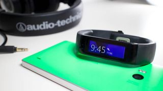 The first generation Microsoft Band and a green Lumia 930