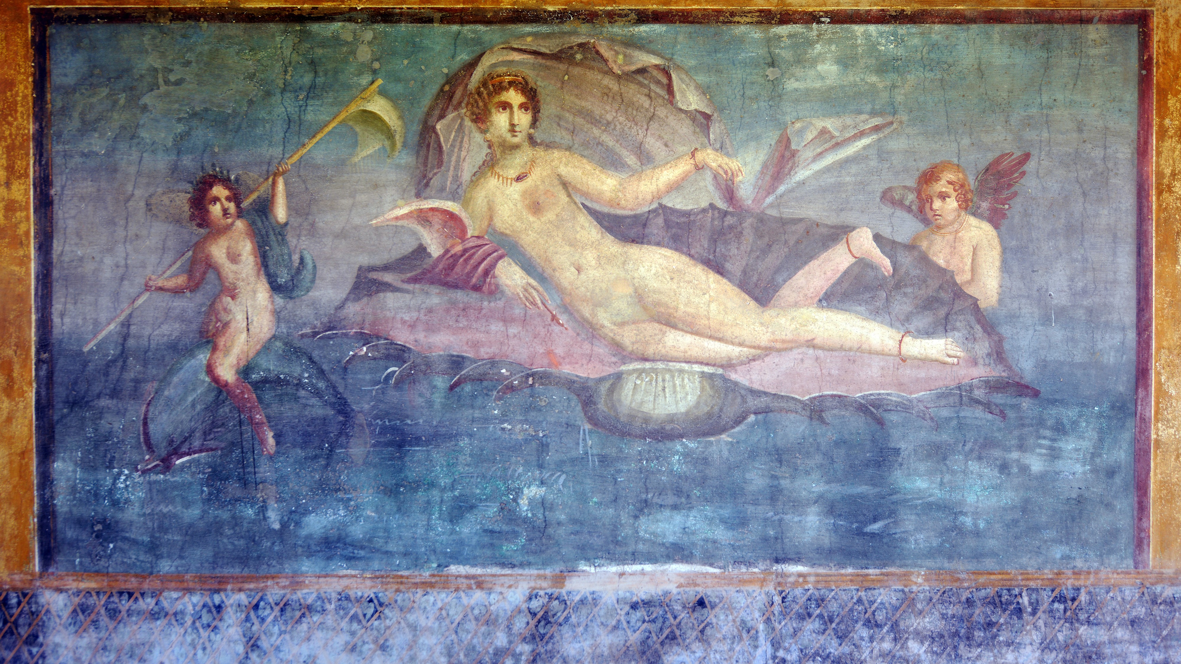 A mural decorating a wall features Venus on a half shell with Cupid and a nereid on a dolphin.