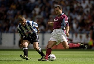 Neil Ruddock in action for West Ham in the 1990s.