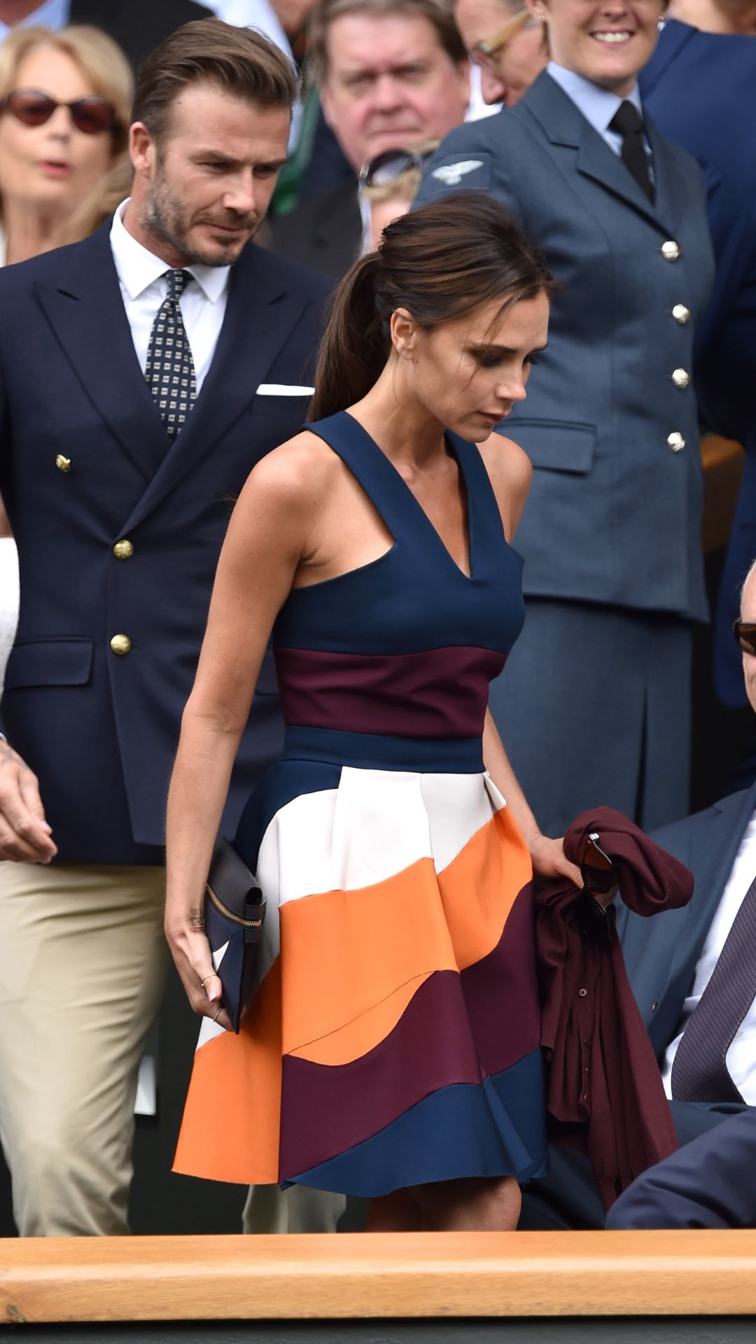 victoria beckham in the crowd at wimbledon wearing a navy colour block dress