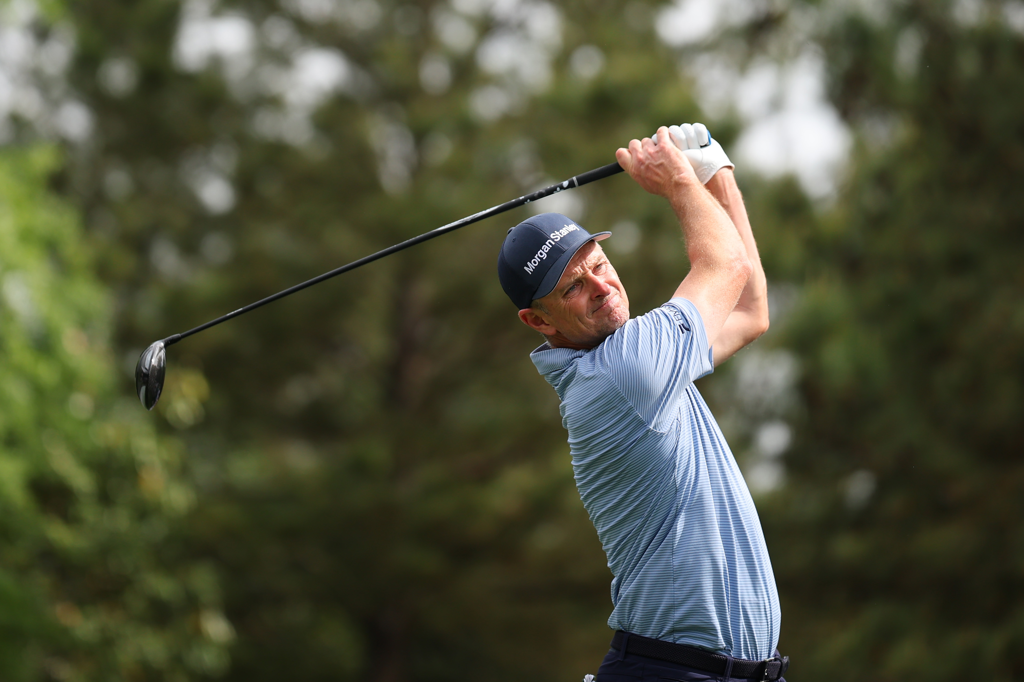 Justin Rose plays a shot from the fifth hole tee box during a practice round prior to the 2026 Masters Tournament at Augusta National Golf Club